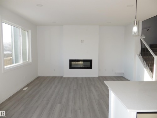 23 Sturtz Place, Leduc, AB - Indoor Photo Showing Living Room With Fireplace