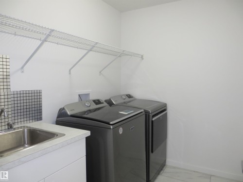 23 Sturtz Place, Leduc, AB - Indoor Photo Showing Laundry Room