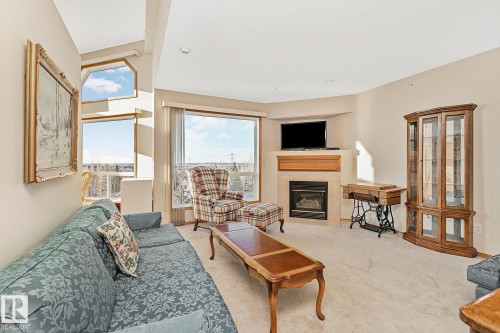 506 182 Haddow Close, Edmonton, AB - Indoor Photo Showing Living Room With Fireplace
