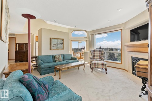 506 182 Haddow Close, Edmonton, AB - Indoor Photo Showing Living Room With Fireplace