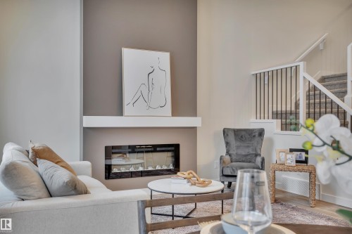 304 Juniper Cove, Leduc, AB - Indoor Photo Showing Living Room With Fireplace