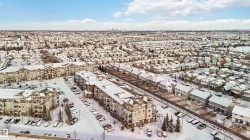 Aerial view of property and surrounding area featuring nearby urban area - 
