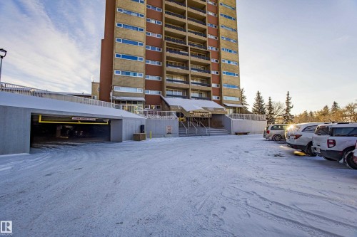 Snow covered building featuring a view of apartment building / complex - 133 8735 165 Street, Edmonton, AB - Outdoor