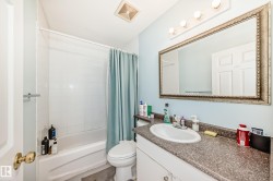 Full bath featuring shower / tub combo and vanity - 