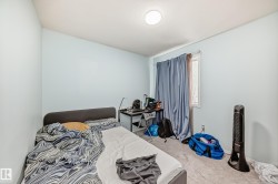 Bedroom with light colored carpet - 