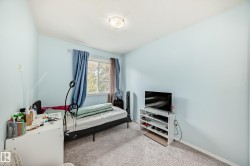 Carpeted bedroom with baseboards - 