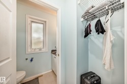 Half bathroom with toilet and baseboards - 