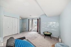 Sitting room with carpet flooring and baseboards - 