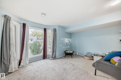 Sitting room featuring carpet floors and baseboards - 