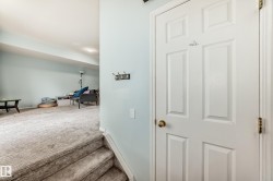 Hall featuring carpet floors - 