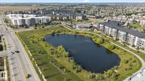 Aerial overview of property's location with a nearby body of water and apartment complex / building - 414 12035 22 Avenue, Edmonton, AB - Outdoor With Body Of Water With View