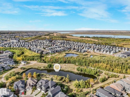 Aerial view of property's location with nearby suburban area and a large body of water - 3140 Magpie Wy, Edmonton, AB - Outdoor With View
