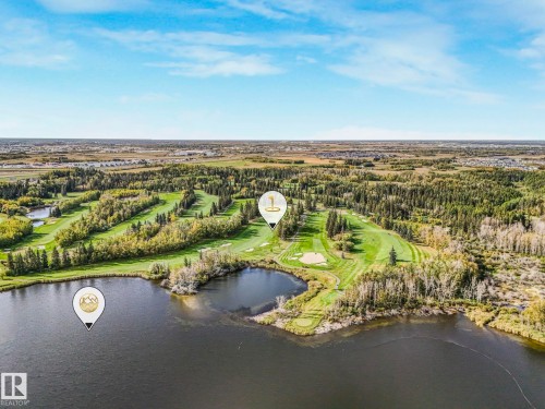 Aerial overview of property's location featuring a nearby body of water and a local golf course - 3140 Magpie Wy, Edmonton, AB - Outdoor With Body Of Water With View