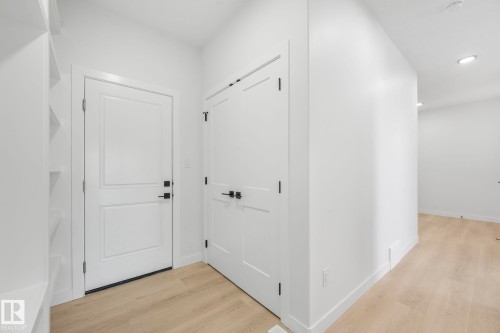Corridor with light wood-type flooring and recessed lighting - 3140 Magpie Wy, Edmonton, AB - Indoor Photo Showing Other Room