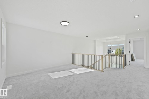 Spare room featuring carpet floors, recessed lighting, and a chandelier - 3140 Magpie Wy, Edmonton, AB - Indoor Photo Showing Other Room