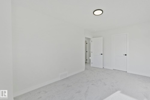 Unfurnished bedroom featuring carpet flooring and baseboards - 3140 Magpie Wy, Edmonton, AB - Indoor Photo Showing Other Room