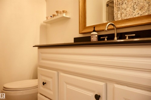 Bathroom with vanity and toilet - 4505 58 Avenue, Barrhead, AB - Indoor Photo Showing Bathroom