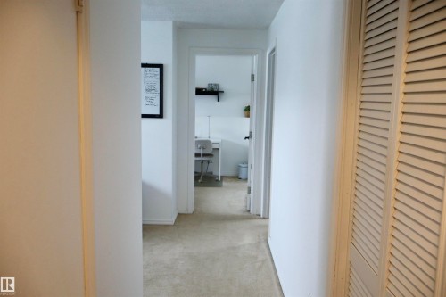 Hallway featuring light colored carpet - 4505 58 Avenue, Barrhead, AB - Indoor Photo Showing Other Room