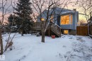 Snow covered house featuring stairs, a wooden deck, and a chimney - 9705 87 Avenue, Edmonton, AB  - Outdoor 