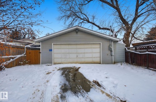 Snow covered garage with a detached garage - 9705 87 Avenue, Edmonton, AB - Outdoor