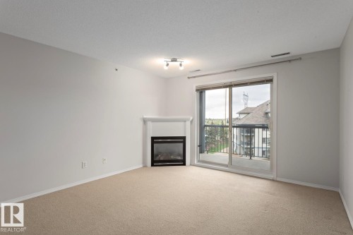 446 16311 95 Street, Edmonton, AB - Indoor Photo Showing Living Room With Fireplace