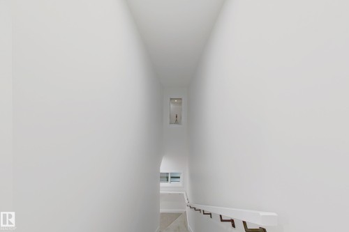View of staircase - 65 18120 28 Avenue, Edmonton, AB - Indoor Photo Showing Other Room