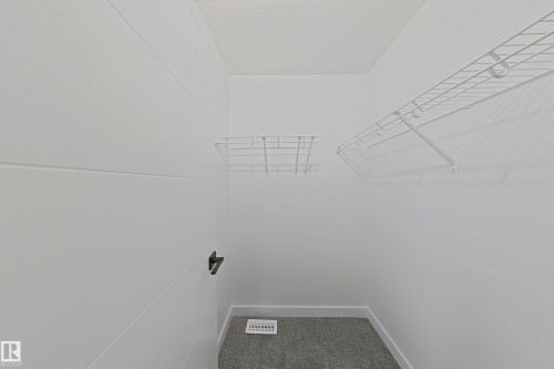 Spacious closet with carpet flooring - 65 18120 28 Avenue, Edmonton, AB - Indoor With Storage