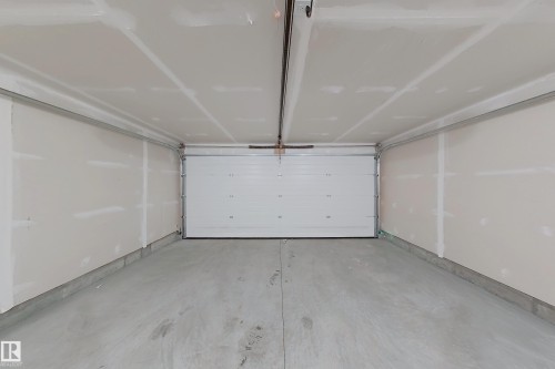 View of garage - 65 18120 28 Avenue, Edmonton, AB - Indoor Photo Showing Garage