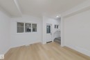 Spare room featuring light wood-style flooring and stairs - 65 18120 28 Avenue, Edmonton, AB  - Indoor Photo Showing Other Room 