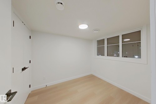Spare room with light wood-style floors and baseboards - 65 18120 28 Avenue, Edmonton, AB - Indoor Photo Showing Other Room