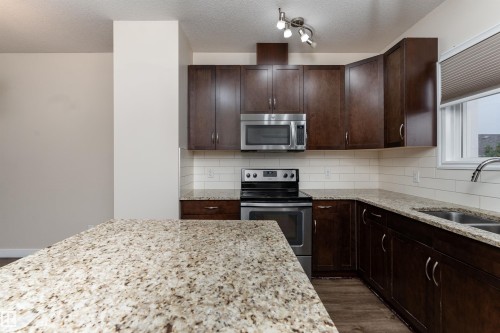 2687 Sir Arthur Currie Way, Edmonton, AB - Indoor Photo Showing Kitchen With Stainless Steel Kitchen With Double Sink
