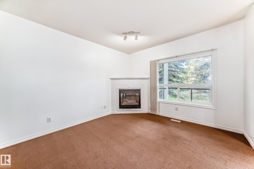102 3010 33 Avenue, Edmonton, AB - Indoor With Fireplace