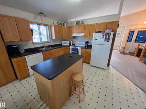 4734 48 Avenue, Rocky Rapids, AB - Indoor Photo Showing Kitchen With Double Sink