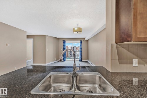 413 11820 22 Avenue, Edmonton, AB - Indoor Photo Showing Kitchen With Double Sink