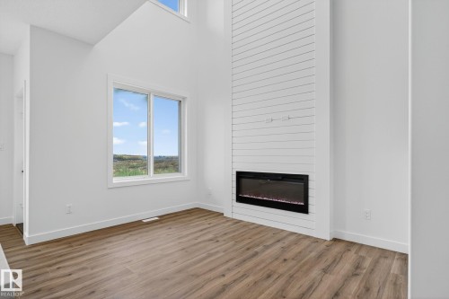147 Pierwyck Loop, Spruce Grove, AB - Indoor Photo Showing Living Room With Fireplace