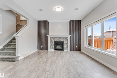 2812 15 Street, Edmonton, AB - Indoor Photo Showing Living Room With Fireplace