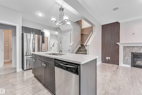 2812 15 Street, Edmonton, AB - Indoor Photo Showing Kitchen With Fireplace With Double Sink