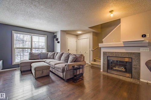 7312 19A Avenue, Edmonton, AB - Indoor Photo Showing Living Room With Fireplace