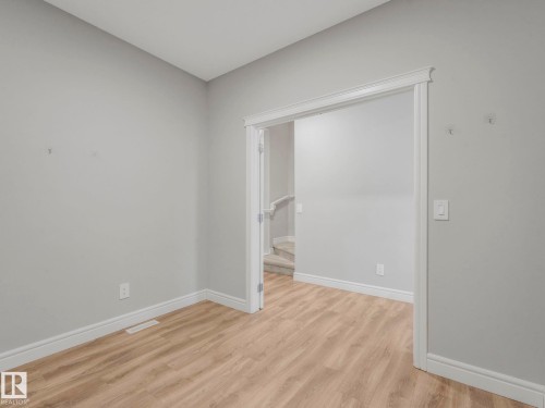 5611 Kootook Place, Edmonton, AB - Indoor Photo Showing Other Room With Fireplace