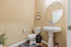 Main floor 2-pce bath conveniently located adjacent to the back entrance. - 