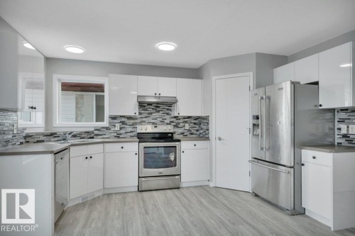 2338 29A Avenue, Edmonton, AB - Indoor Photo Showing Kitchen With Stainless Steel Kitchen With Double Sink With Upgraded Kitchen