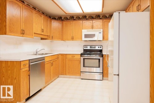 111 10935 21 Avenue, Edmonton, AB - Indoor Photo Showing Kitchen With Double Sink