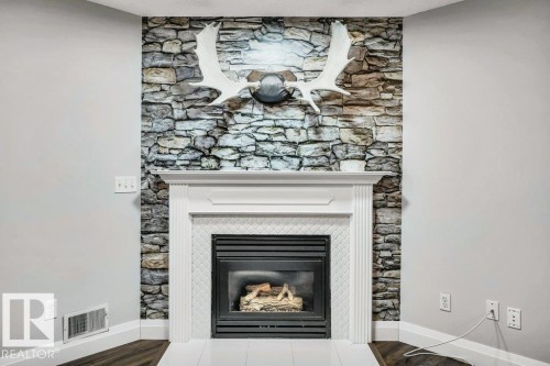 2812 40A Avenue, Edmonton, AB - Indoor Photo Showing Living Room With Fireplace