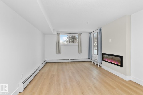 114 9504 182 Street, Edmonton, AB - Indoor Photo Showing Other Room With Fireplace