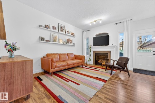 1954 119A Street, Edmonton, AB - Indoor Photo Showing Living Room With Fireplace