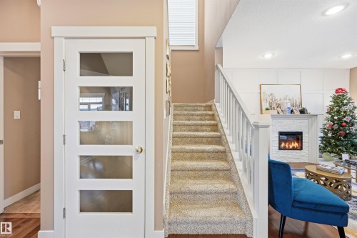 2292 Warry Loop, Edmonton, AB - Indoor Photo Showing Other Room With Fireplace