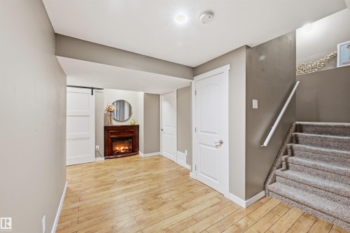 2292 Warry Loop, Edmonton, AB - Indoor Photo Showing Other Room With Fireplace
