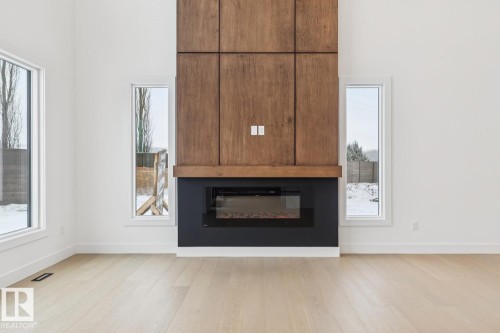143 25122 Sturgeon Road, Rural Sturgeon County, AB - Indoor Photo Showing Living Room With Fireplace