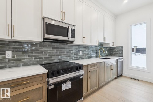 143 25122 Sturgeon Road, Rural Sturgeon County, AB - Indoor Photo Showing Kitchen With Upgraded Kitchen