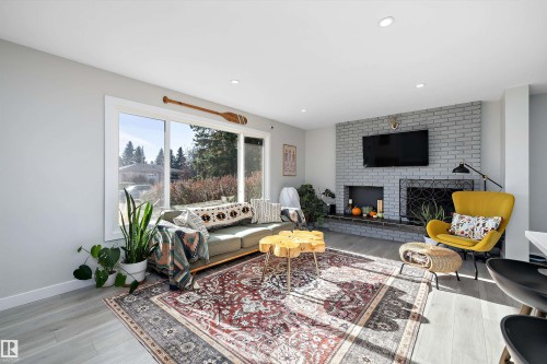 6304 94A Avenue, Edmonton, AB - Indoor Photo Showing Living Room With Fireplace